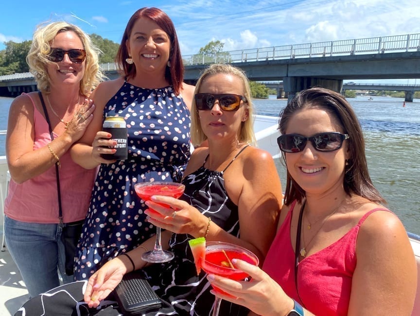 Cruise group of ladies enjoying a drink on the rear deck of Crusader 1
