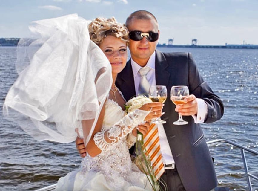 Wedding - Couple toasting on the bow
